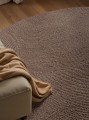 Dywan-okragly-welniany-do-salonu-150cm-brazowy-wzor-w-polkola-efekt-3d-Marka-Hanse-Home.jpg
